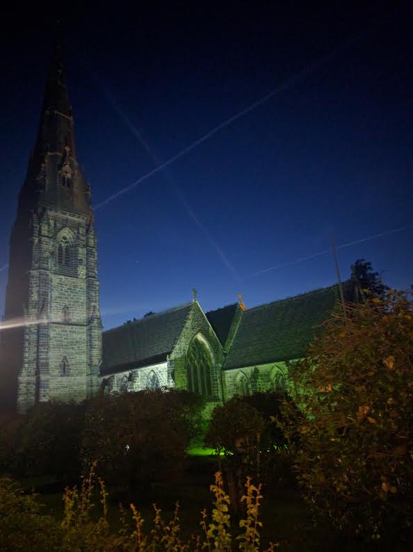 The church illuminated at night